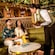A Cast Member serving Guests beverages at Tiana’s Bayou Lounge on board the Disney Adventure